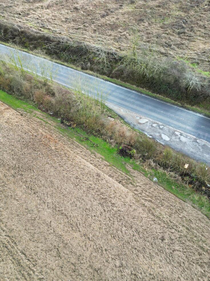 Aerial View of British Countryside and Agricultural Farm Land at Village of England UK. March 1st, 2024 photo