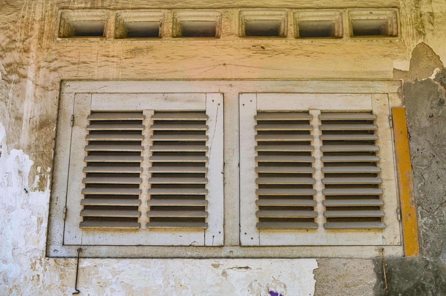 a wooden window in an ancient house photo