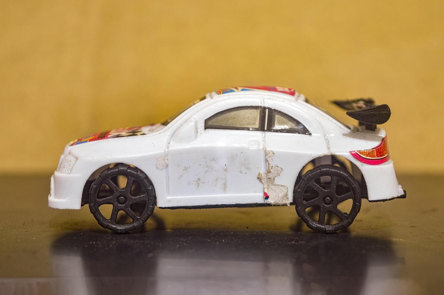 a small white plastic toy car photo