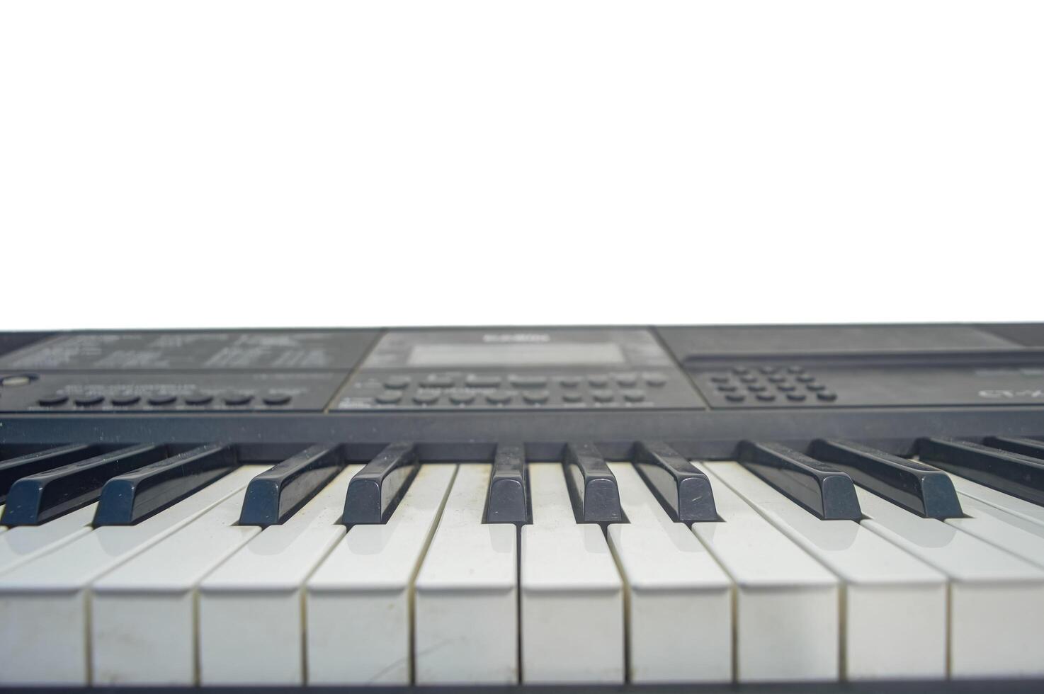 digital piano on a plain white wall background photo