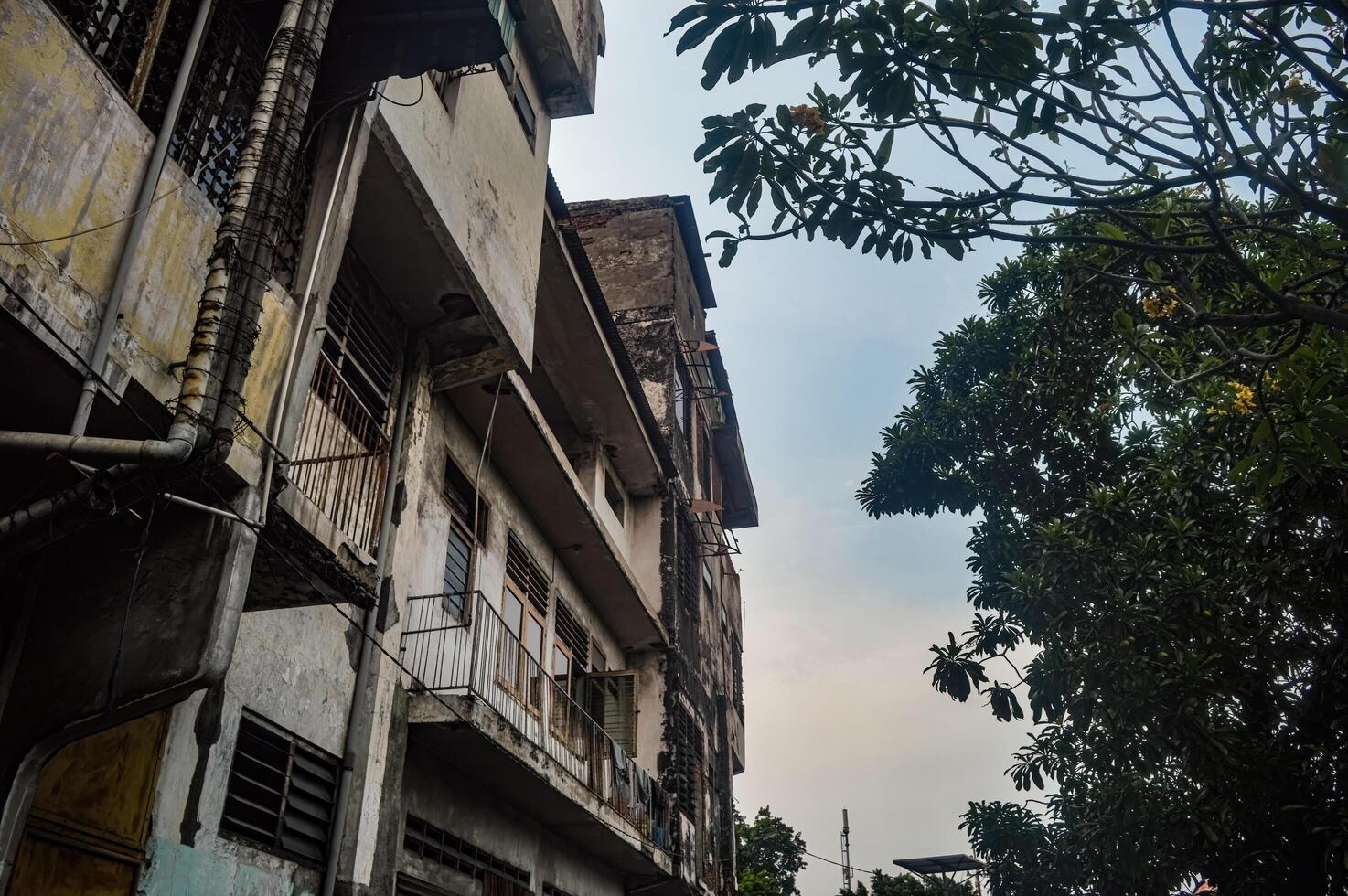 an old multi-storey building that looks dull photo