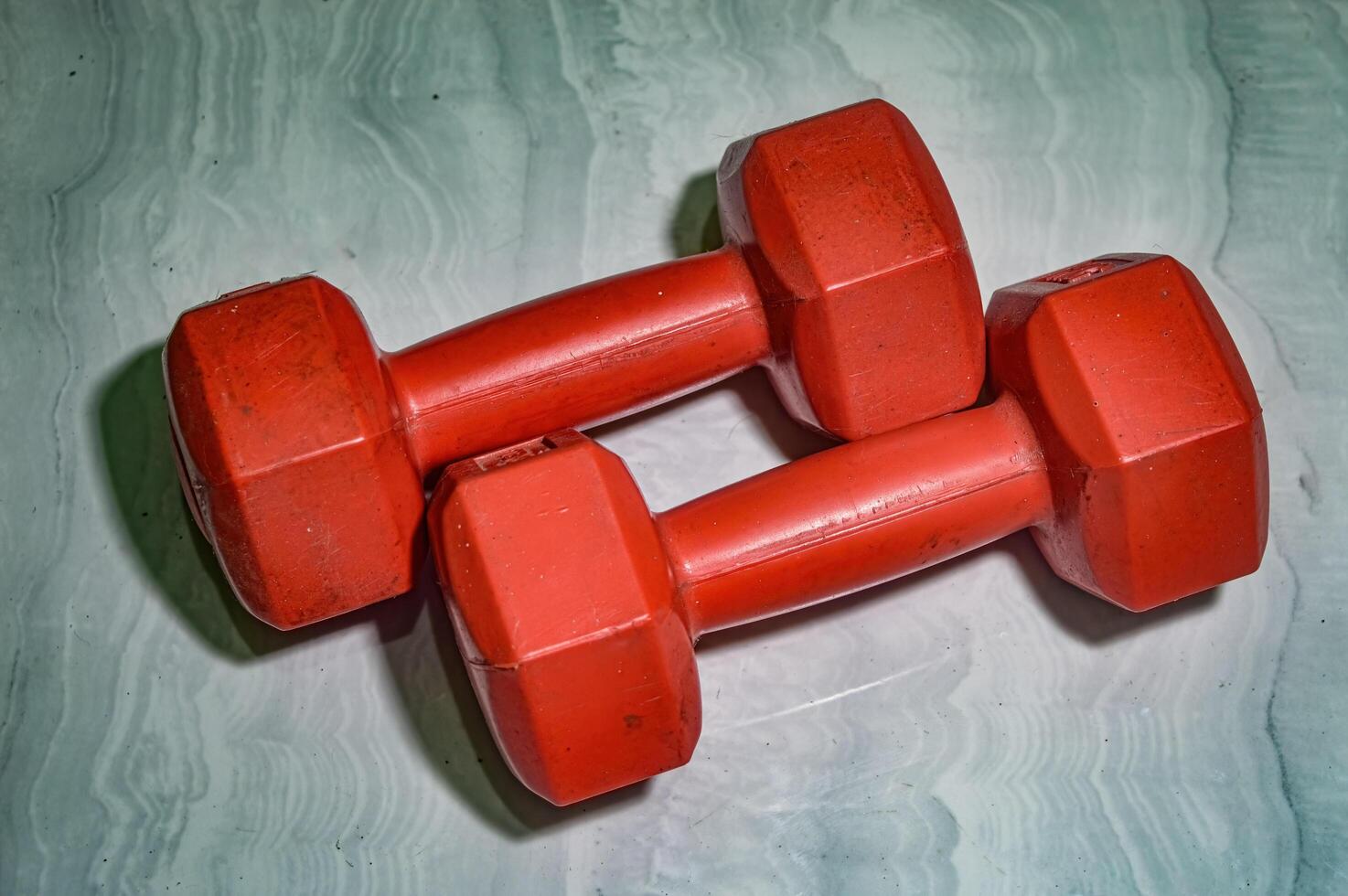 a pair of dumbbells weighing one kilogram on the floor photo