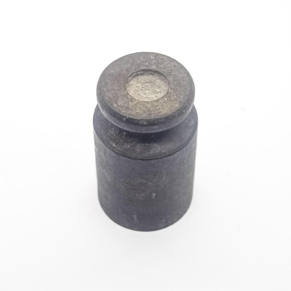 Old rusty iron scale weight isolated on white background. perfect for economics, finance and business articles photo