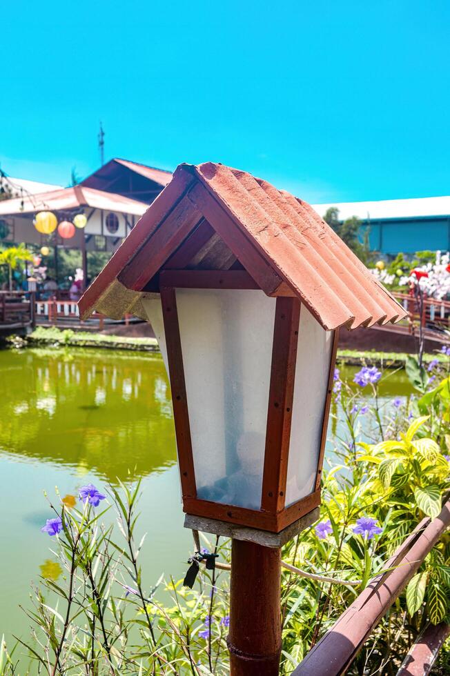 an antique Japanese-style garden lamp in a restaurant garden photo