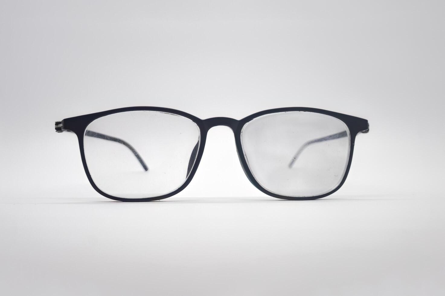 a pair of black men's glasses isolated on a white background photo