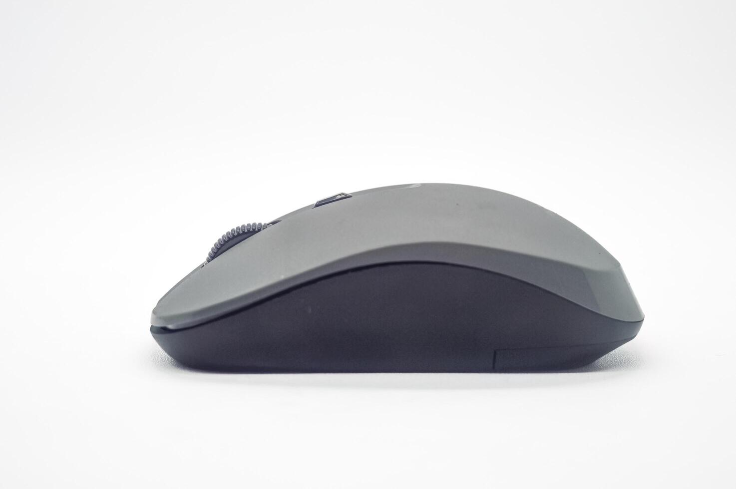 side view of a wireless mouse isolated on a white background photo