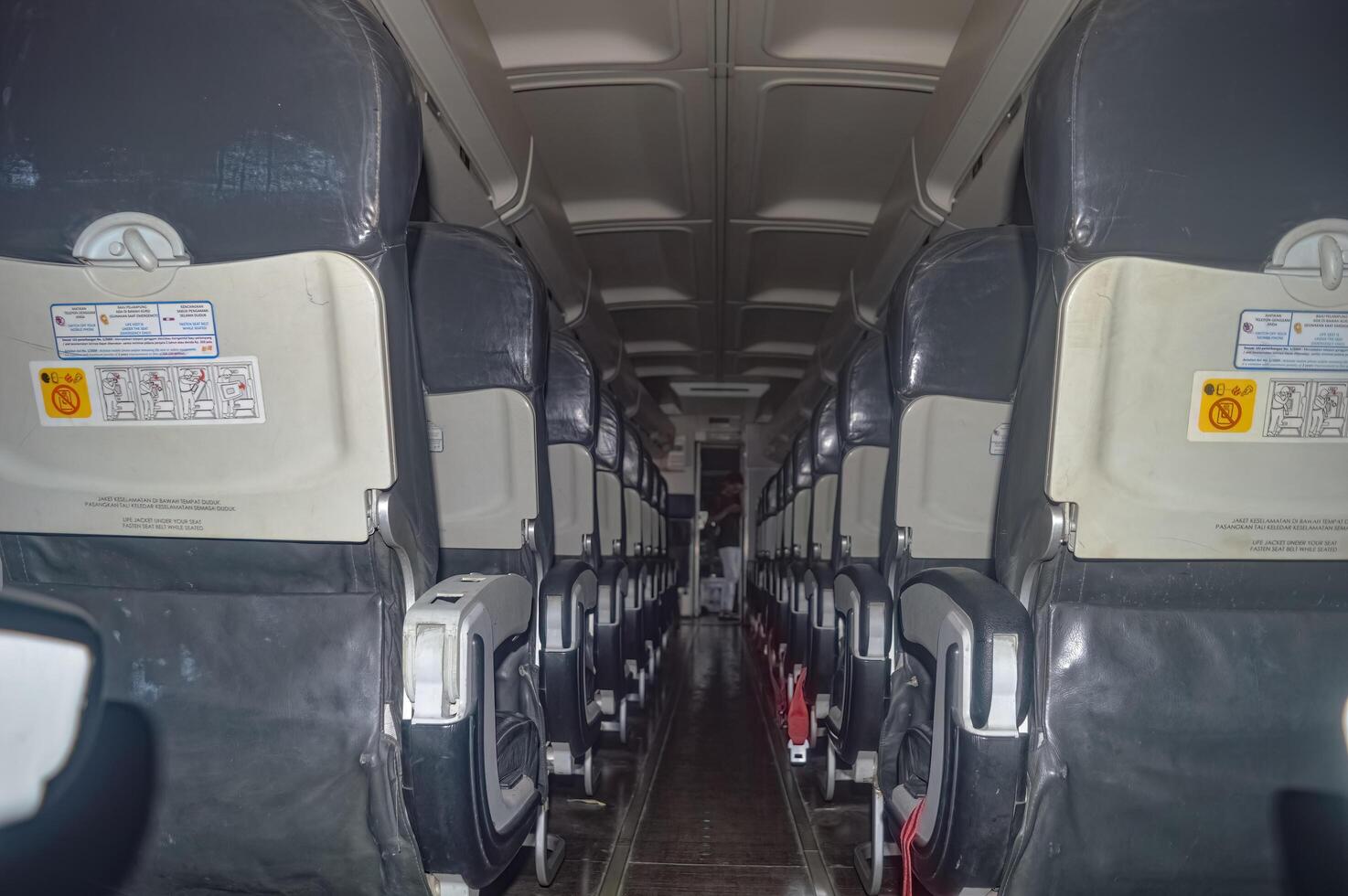 The interior of a narrow body aircraft complete with seats photo