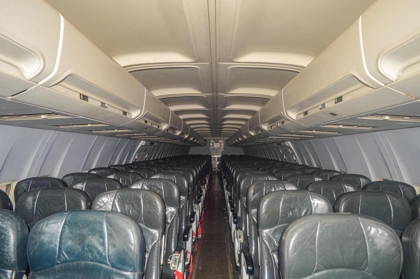 The interior of a narrow body aircraft complete with seats photo