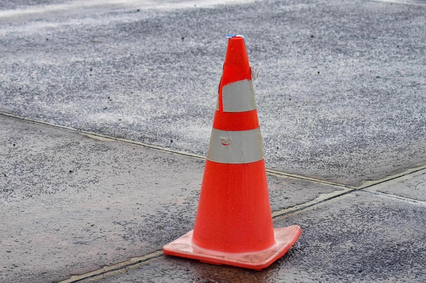 a traffic cone in the middle of the Juanda International Airport apron photo