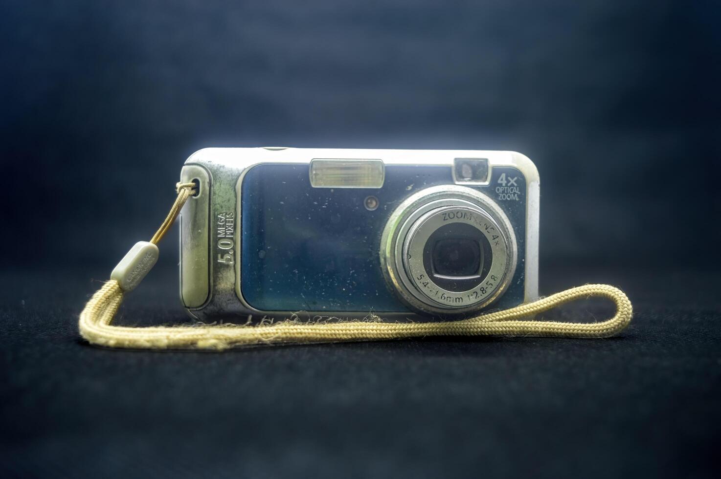 old school pocket camera isolated on black background photo