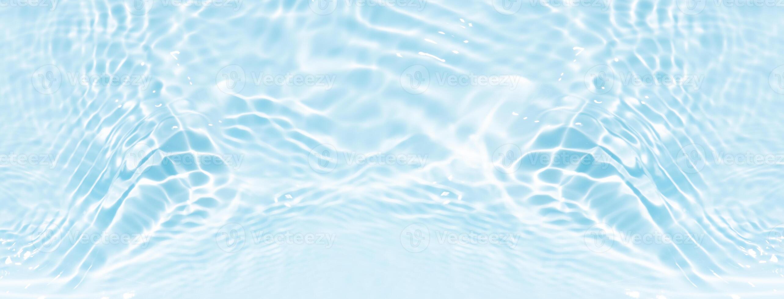 Bluewater waves on the surface ripples blurred. Defocus blurred transparent blue colored clear calm water surface texture with splash and bubbles. Water waves with shining pattern texture background. photo