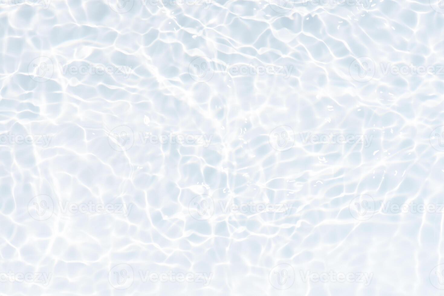Bluewater waves on the surface ripples blurred. Defocus blurred transparent blue colored clear calm water surface texture with splash and bubbles. Water waves with shining pattern texture background. photo