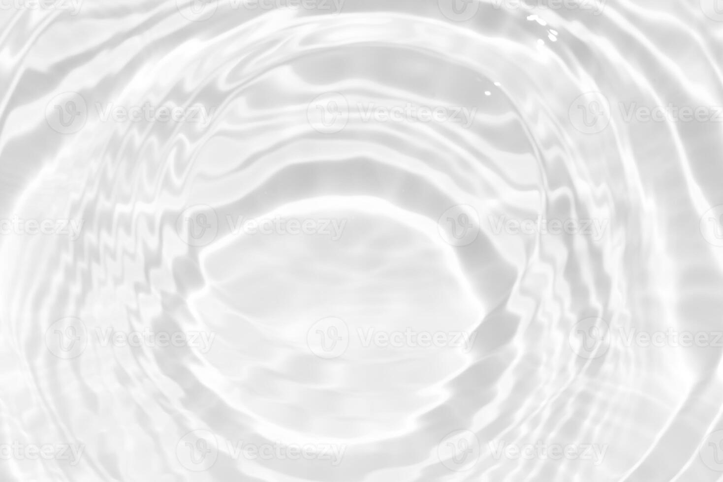 Bluewater waves on the surface ripples blurred. Defocus blurred transparent blue colored clear calm water surface texture with splash and bubbles. Water waves with shining pattern texture background. photo