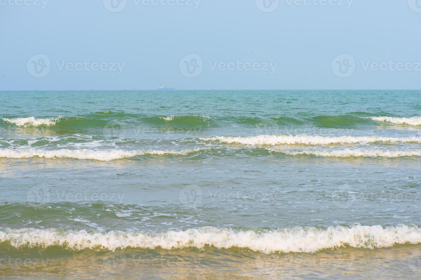 Bluewater waves on the surface ripples blurred. Defocus blurred transparent blue colored clear calm water surface texture with splash and bubbles. Water waves with shining pattern texture background. photo