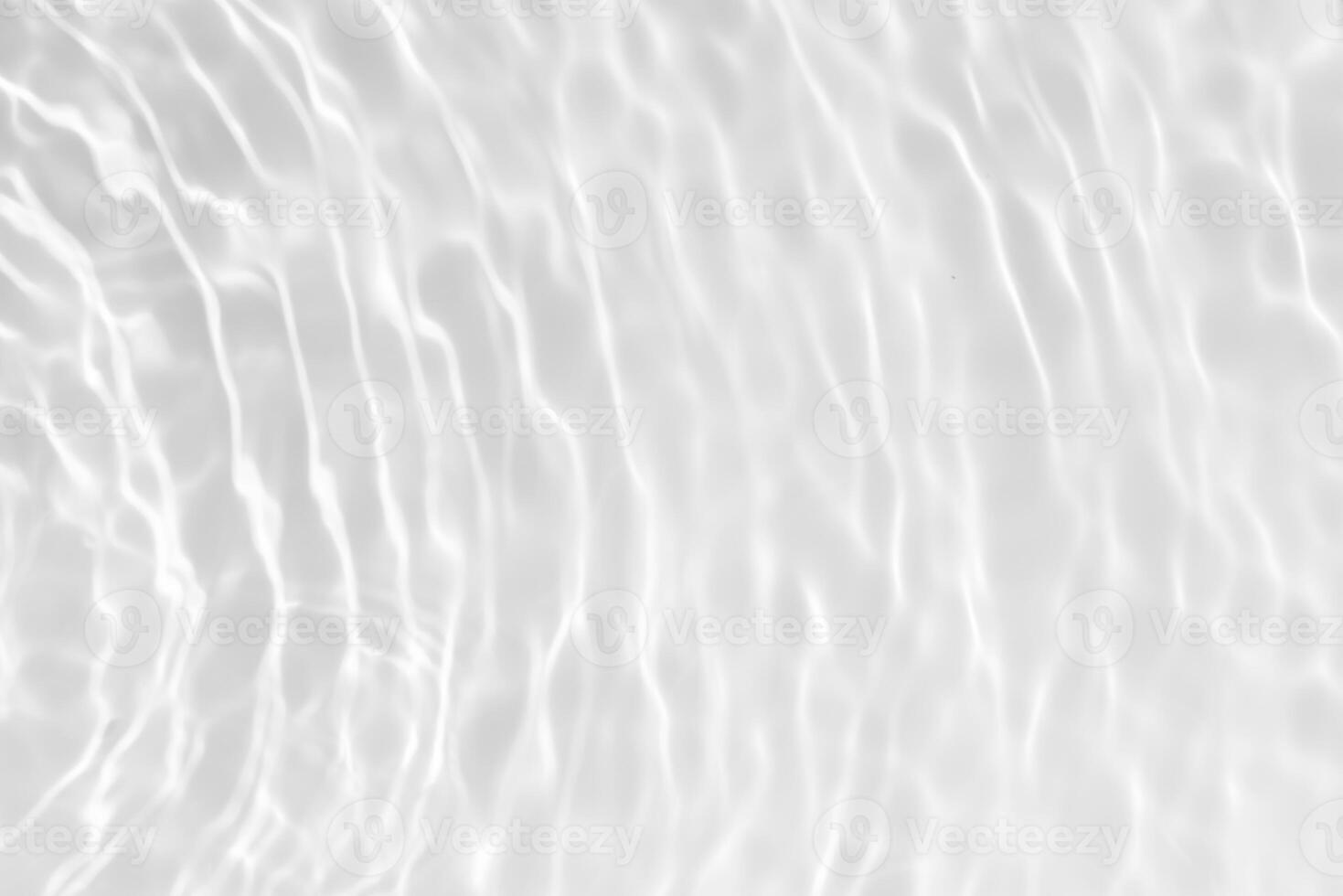 Bluewater waves on the surface ripples blurred. Defocus blurred transparent blue colored clear calm water surface texture with splash and bubbles. Water waves with shining pattern texture background. photo