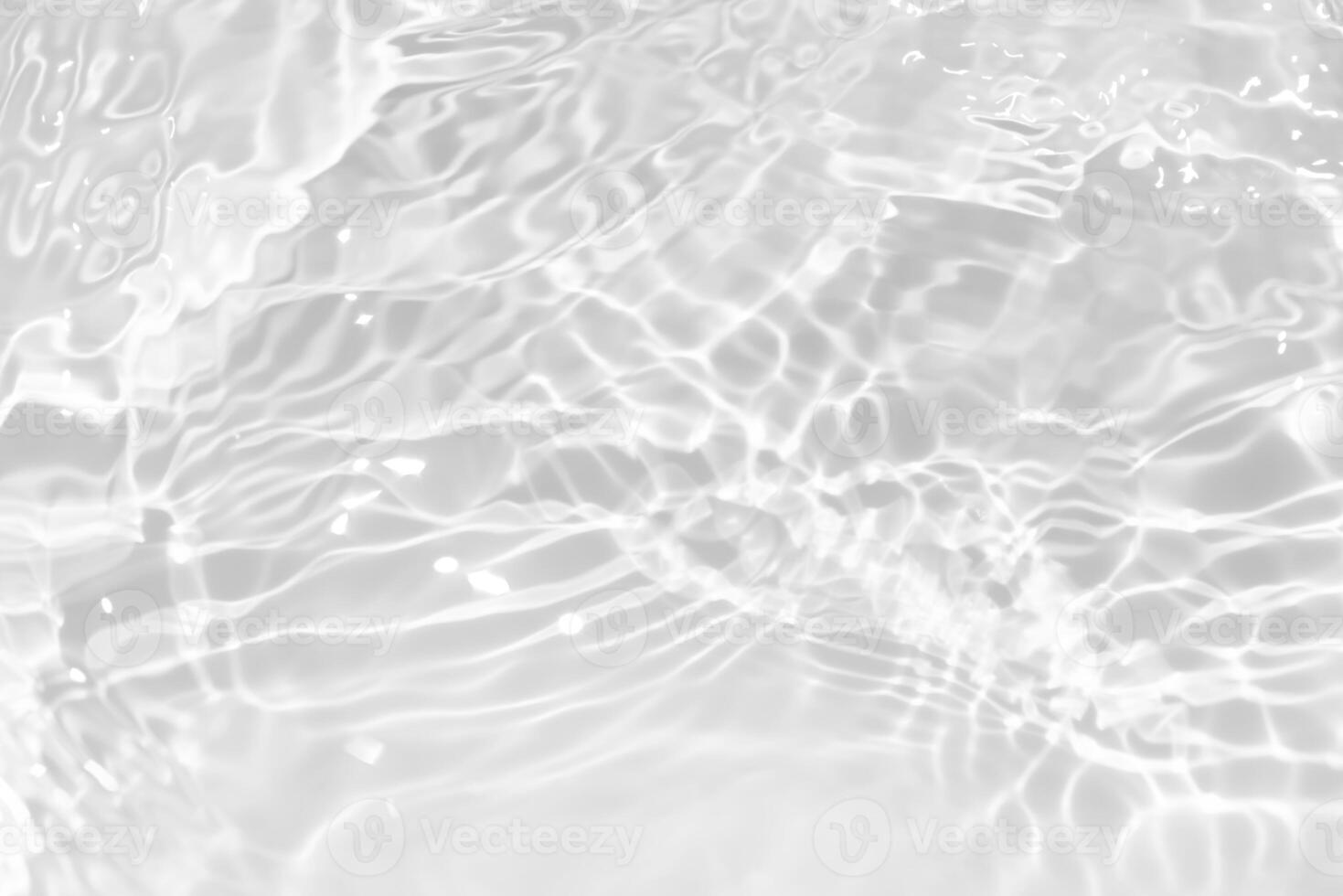 Bluewater waves on the surface ripples blurred. Defocus blurred transparent blue colored clear calm water surface texture with splash and bubbles. Water waves with shining pattern texture background. photo