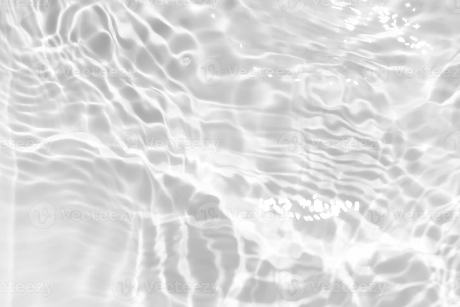 Bluewater waves on the surface ripples blurred. Defocus blurred transparent blue colored clear calm water surface texture with splash and bubbles. Water waves with shining pattern texture background. photo