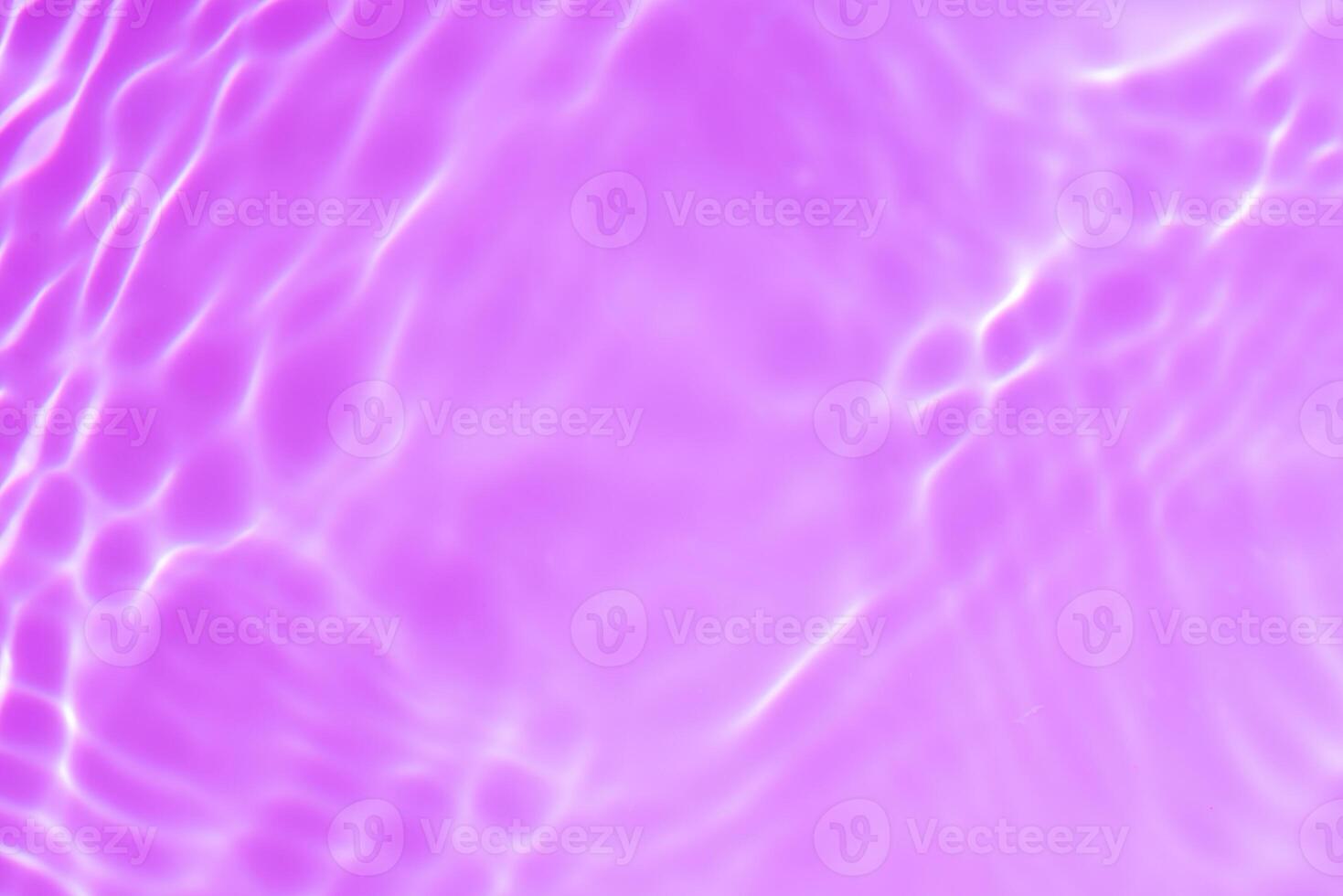 Bluewater waves on the surface ripples blurred. Defocus blurred transparent blue colored clear calm water surface texture with splash and bubbles. Water waves with shining pattern texture background. photo