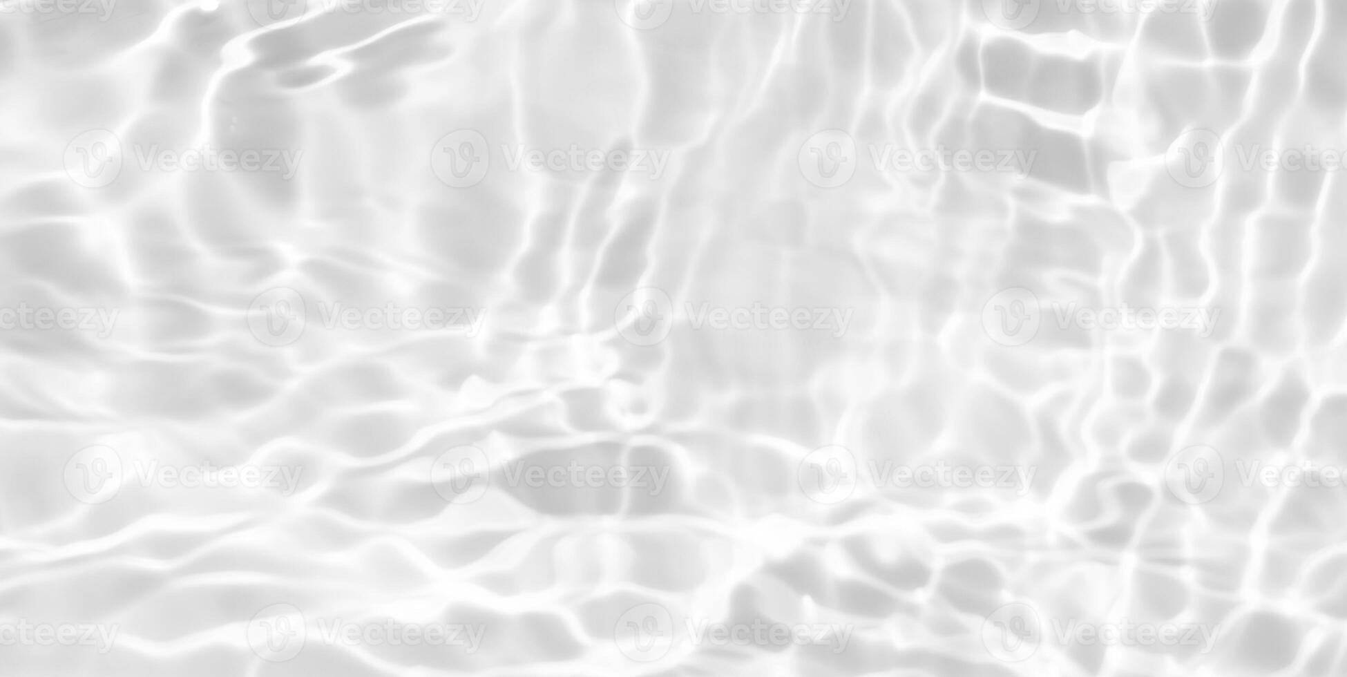 Bluewater waves on the surface ripples blurred. Defocus blurred transparent blue colored clear calm water surface texture with splash and bubbles. Water waves with shining pattern texture background. photo