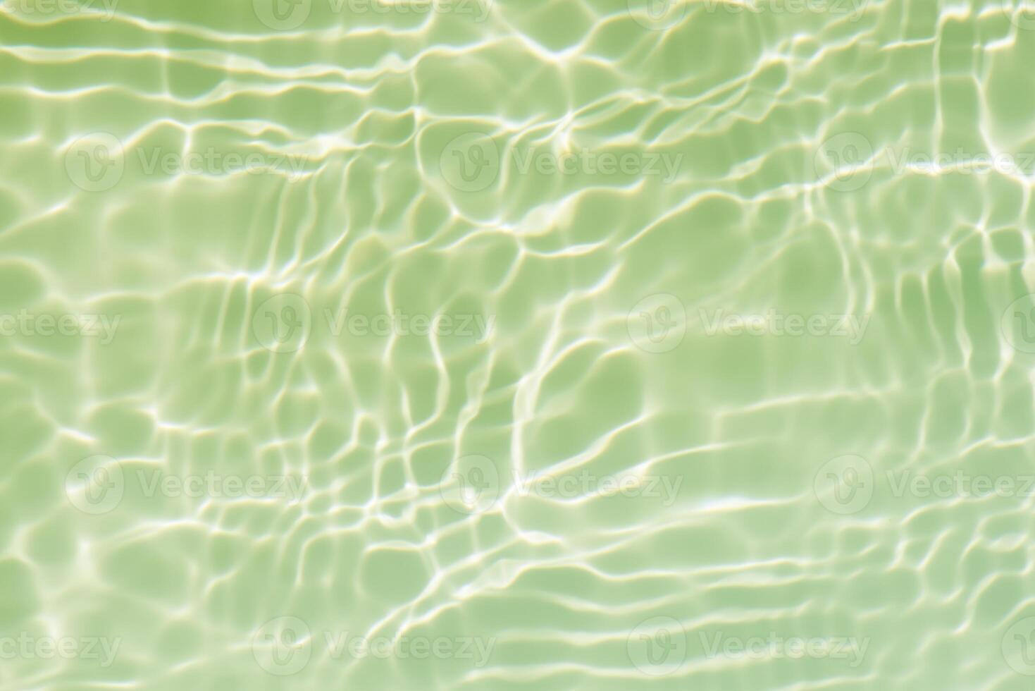 Bluewater waves on the surface ripples blurred. Defocus blurred transparent blue colored clear calm water surface texture with splash and bubbles. Water waves with shining pattern texture background. photo