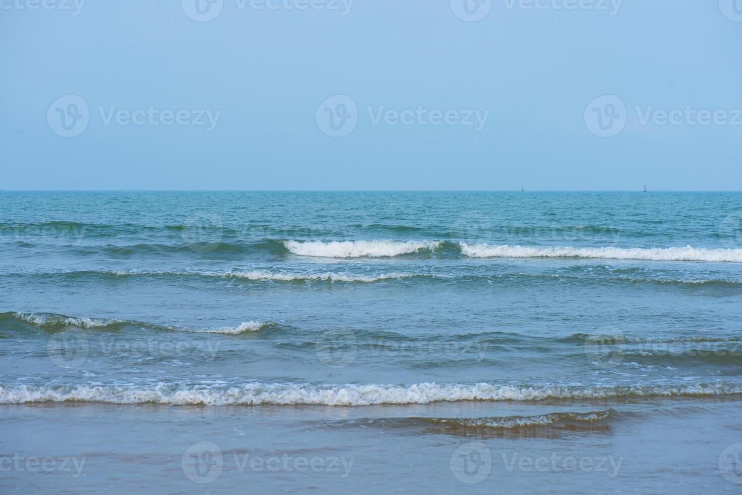 Bluewater waves on the surface ripples blurred. Defocus blurred transparent blue colored clear calm water surface texture with splash and bubbles. Water waves with shining pattern texture background. photo