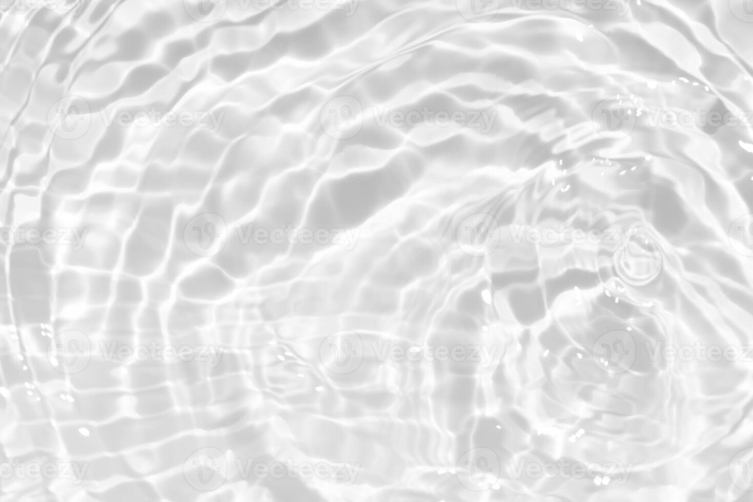White water with ripples on the surface. Defocus blurred transparent white colored clear calm water surface texture with splashes and bubbles. Water waves with shining pattern texture background. photo