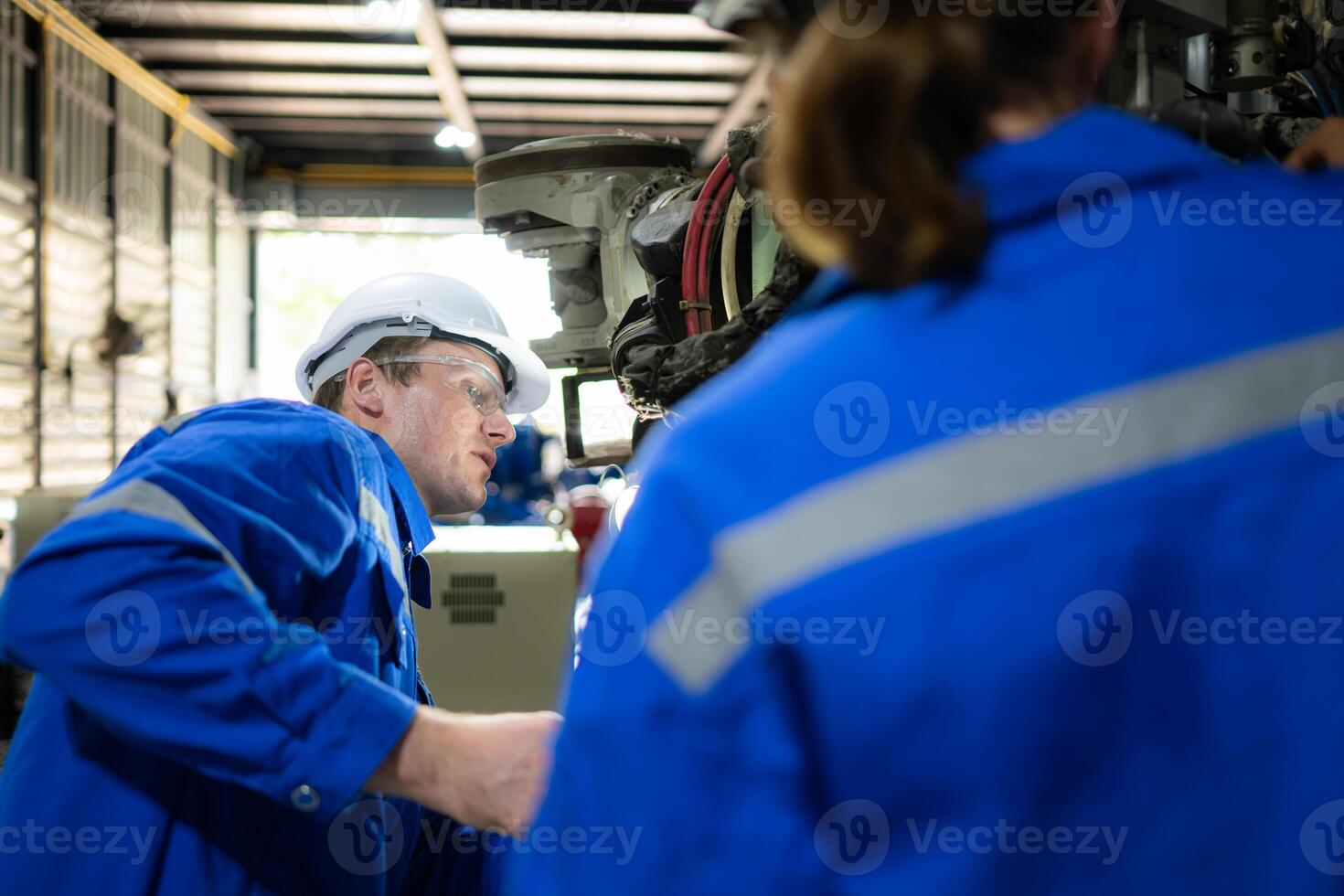 Both of engineers working together in a robotic arm factory, Robotic arm industry and engineering concept. photo