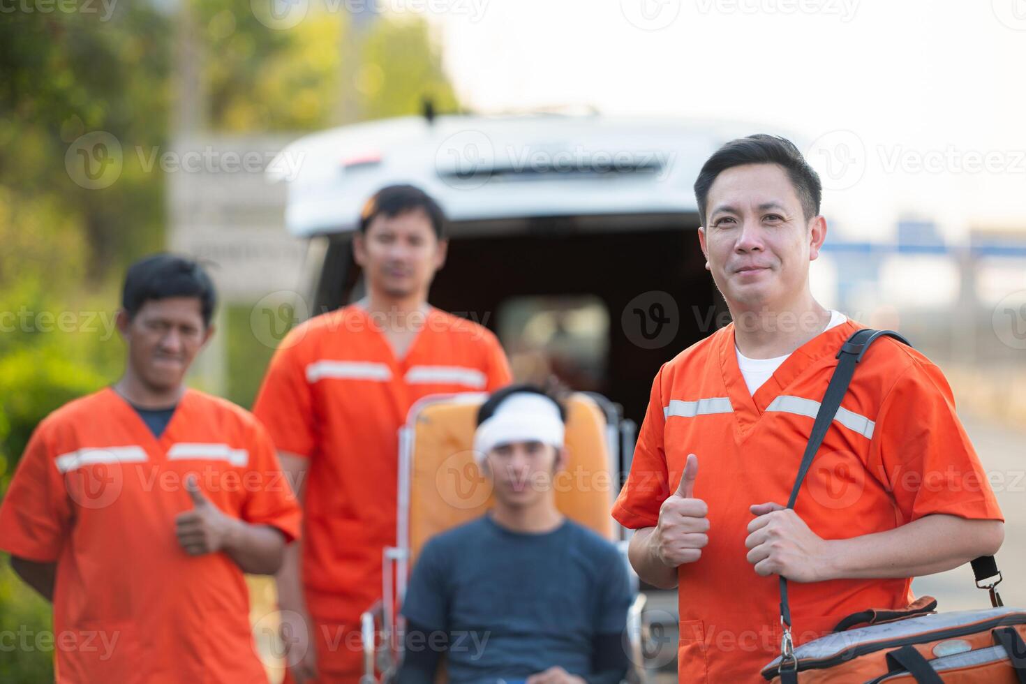 Portrait of paramedic team  is assisting an injured man in an emergency situation on the road. photo