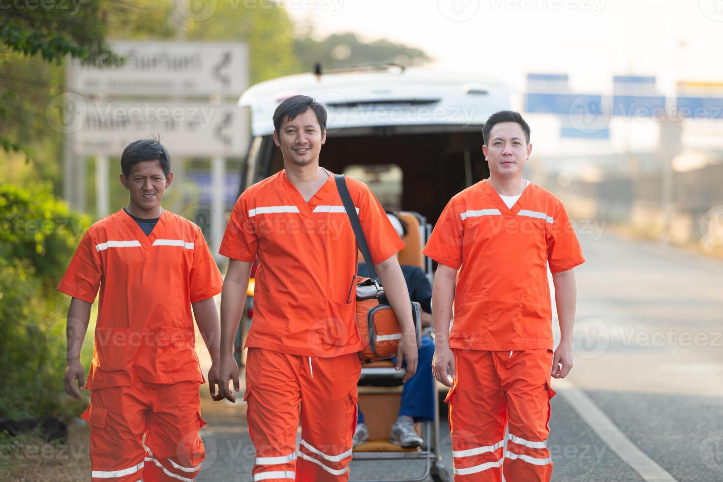 Portrait of paramedic team  is assisting an injured man in an emergency situation on the road. photo