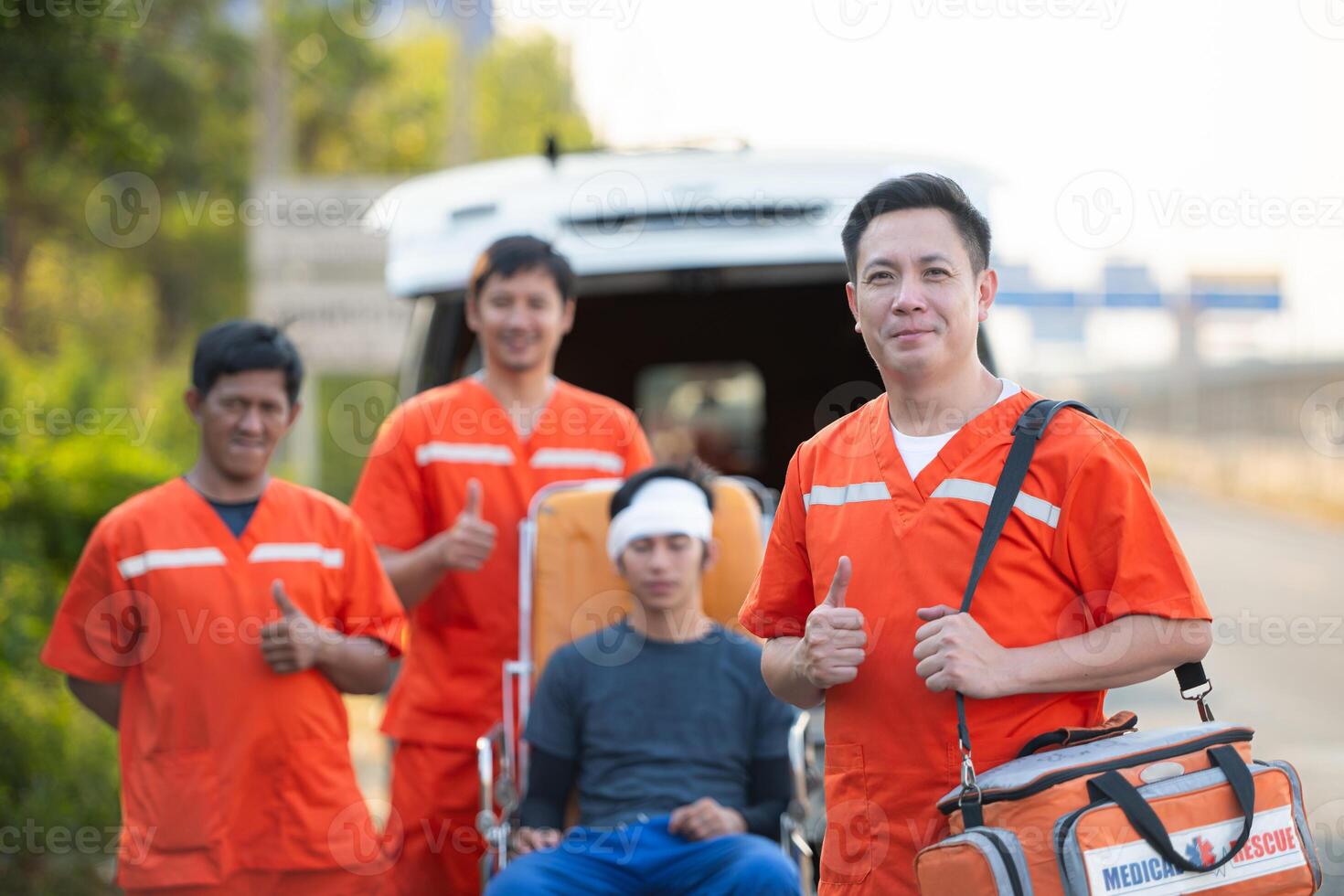 Portrait of paramedic team  is assisting an injured man in an emergency situation on the road. photo