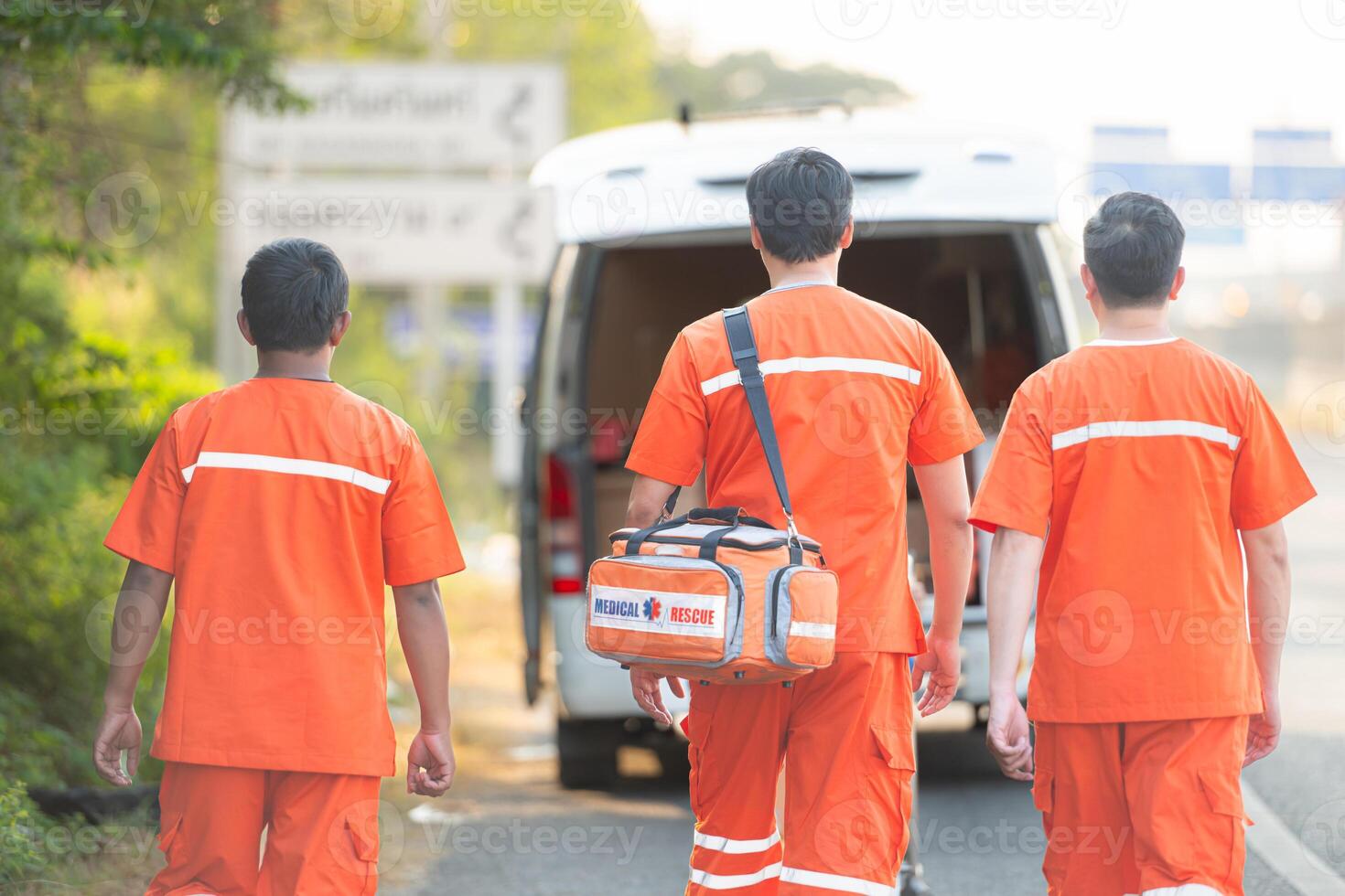 Portrait of paramedic team  is assisting an injured man in an emergency situation on the road. photo