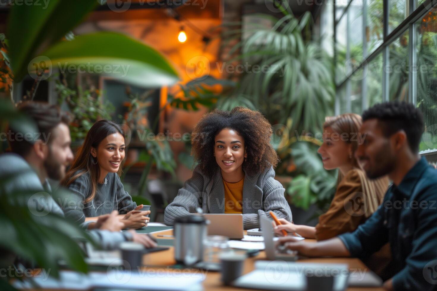 AI generated A diverse group of people from different ethnicities brainstorming in a modern cozy meeting room, with a relaxed work-life balance atmosphere. photo