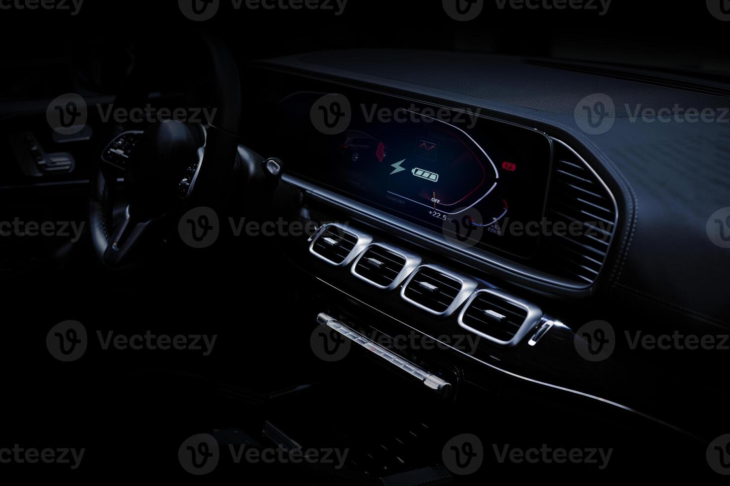 Electric car display screen that is showing the display of electric charging. photo