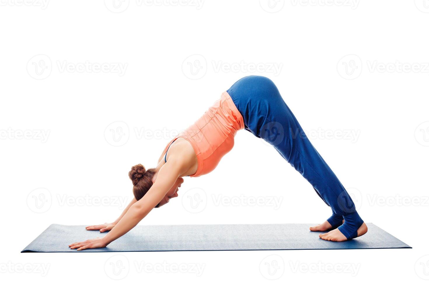 Woman doing Ashtanga Vinyasa Yoga asana Adho mukha svanasana photo