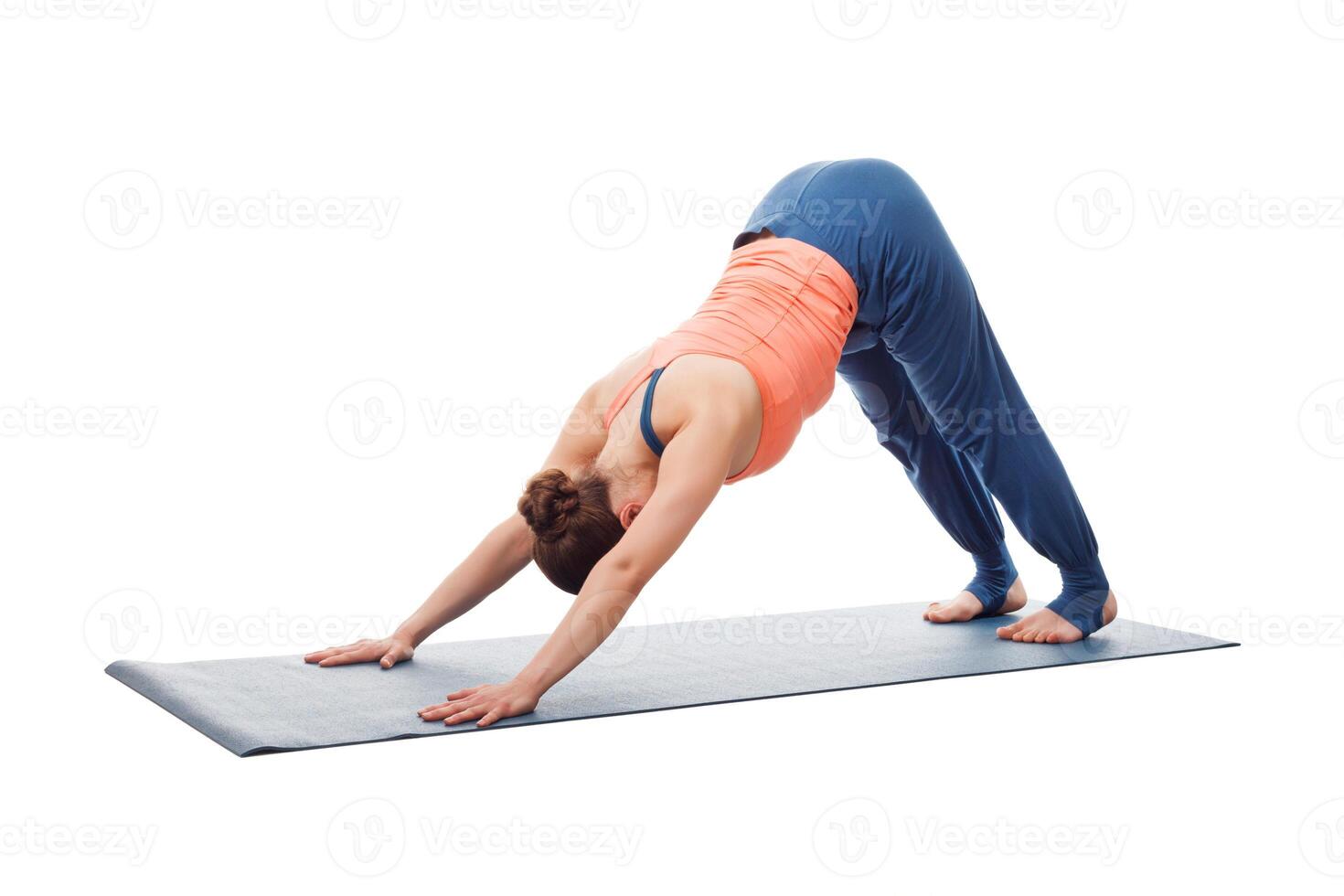 Beautiful sporty fit yogi girl practices yoga asana adhomukha sv photo