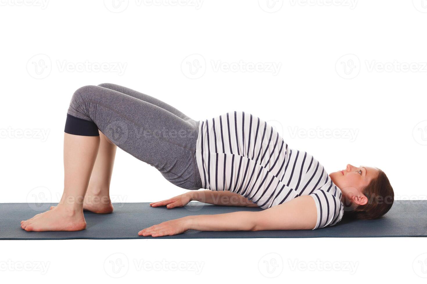 Pregnant woman doing yoga asana Purvottanasana photo