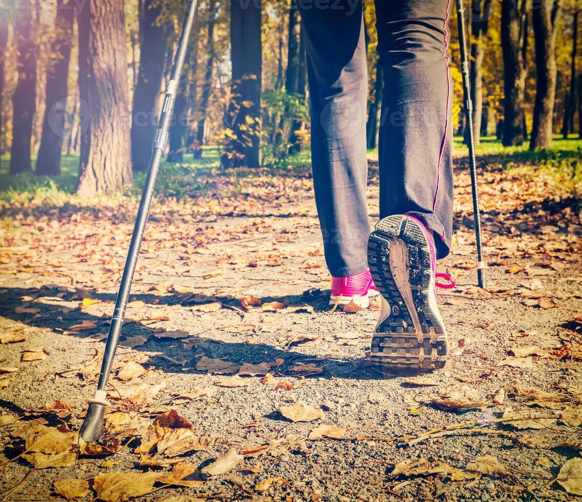 Nordic walking outdoors feet close up photo