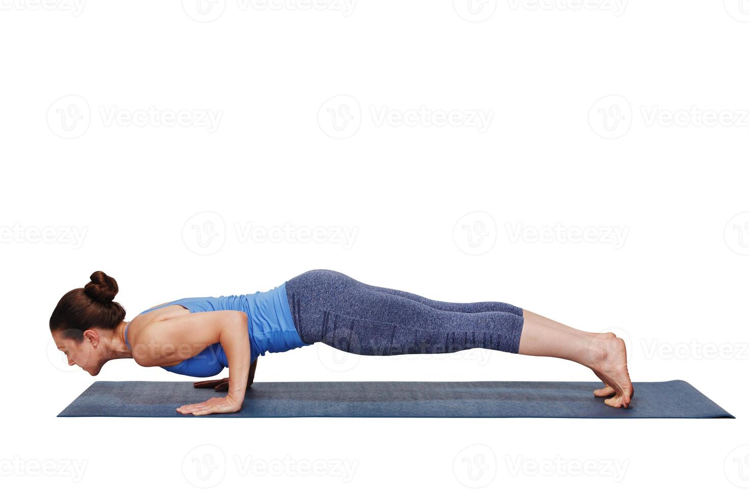 Woman doing Ashtanga Vinyasa yoga Surya Namaskar Sun Salutation photo