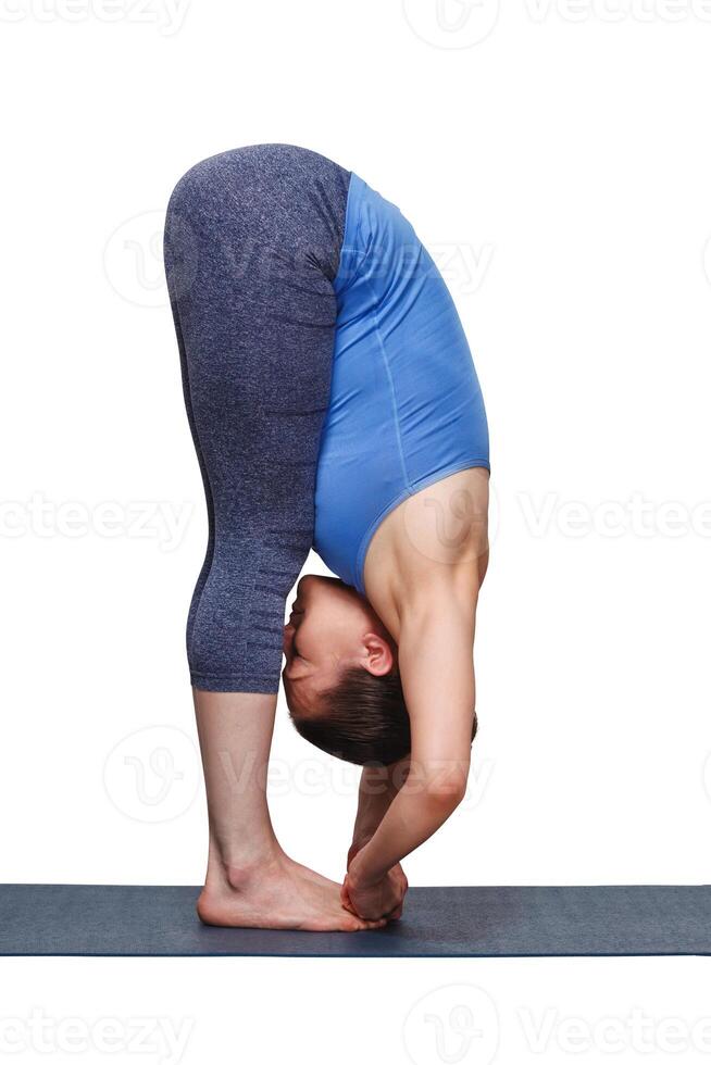 Woman doing Ashtanga Vinyasa yoga asana Padangusthasana   foot t photo