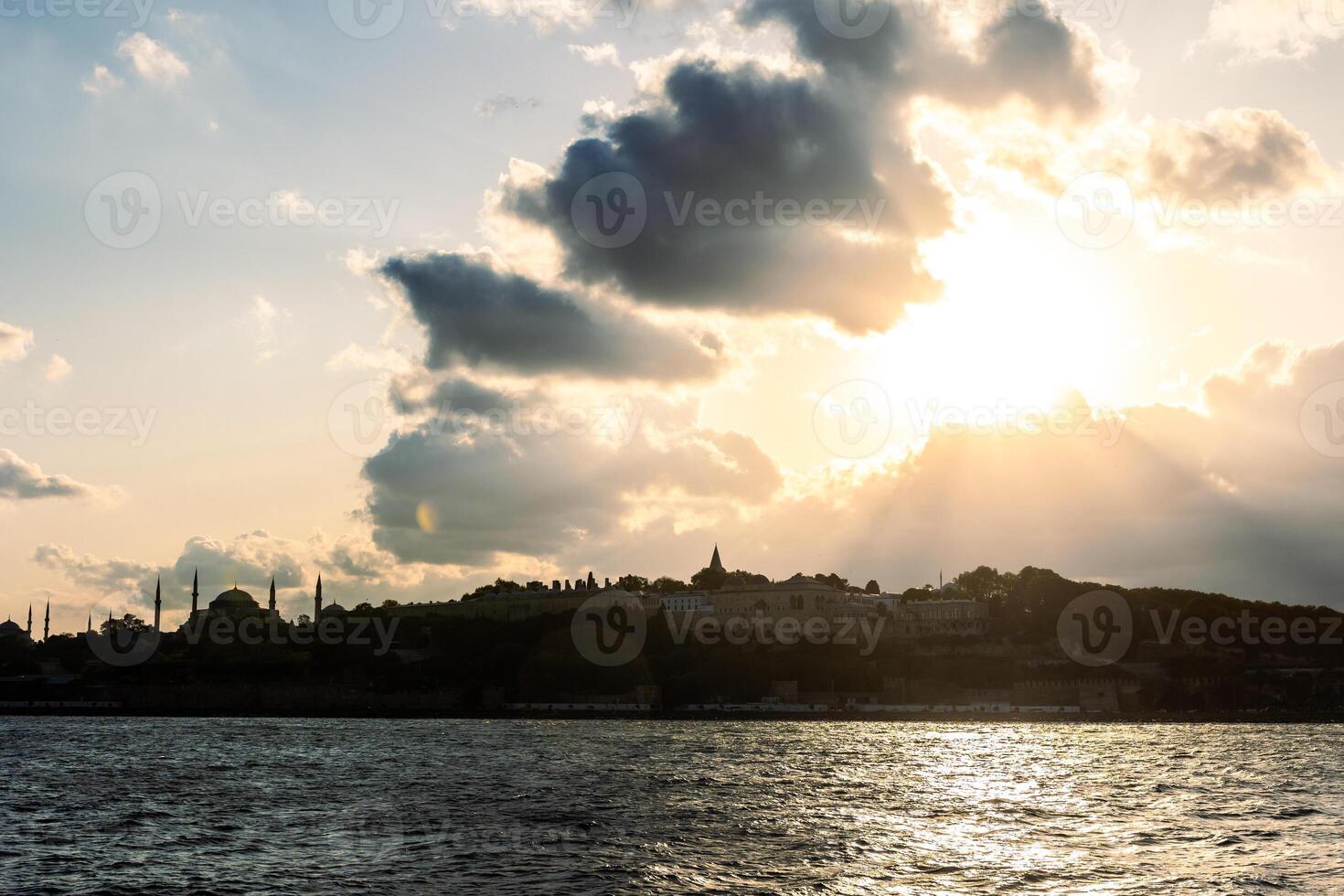 Istanbul silhouette with dramatic clouds at sunset photo
