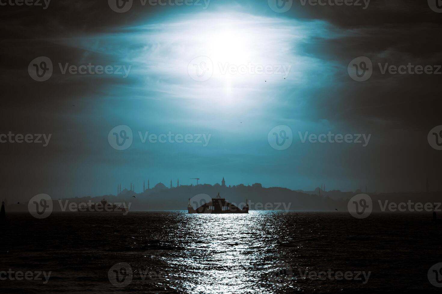 Istanbul background photo. Silhouette of a ferry and cityscape of Istanbul photo