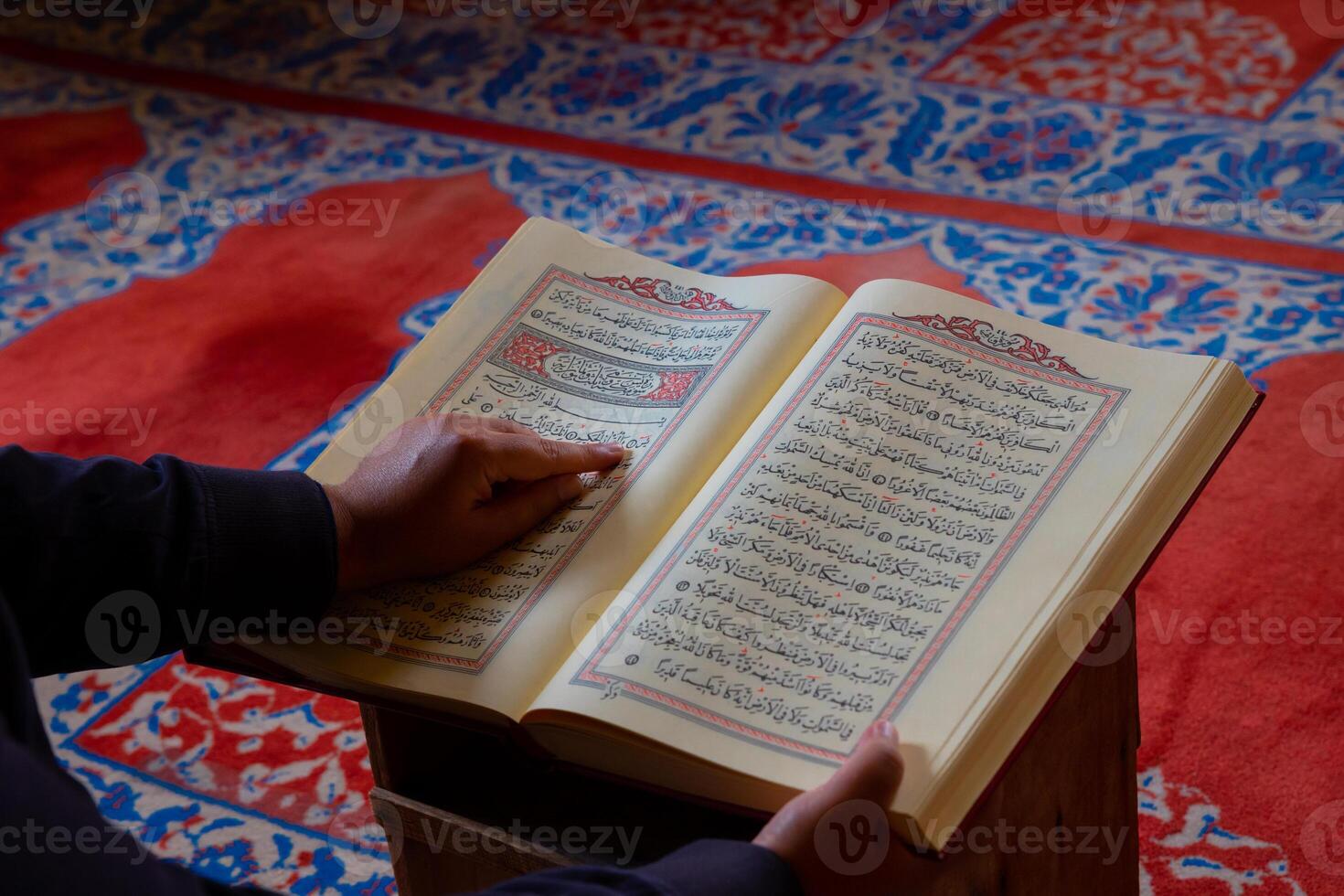 Ramadan or islamic background photo. Muslim man reading the holy Quran photo