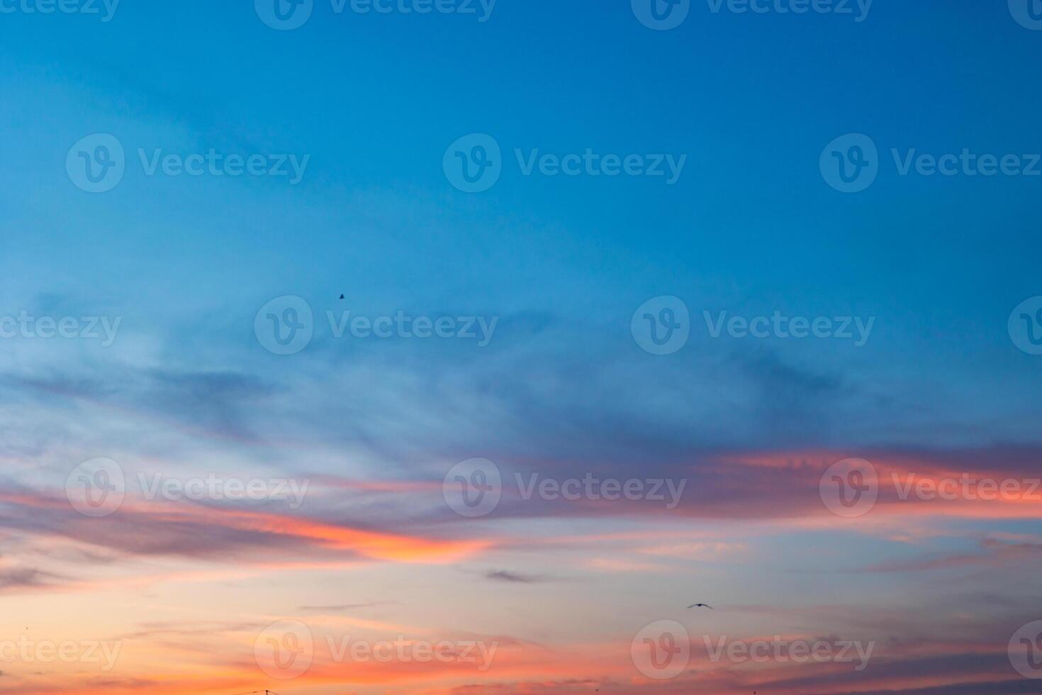 Beautiful partly cloudy sky at sunset or sunrise with pastel colors photo