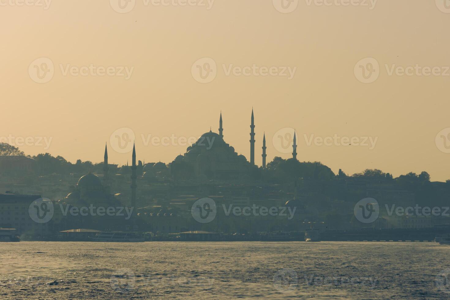 Istanbul background photo. Suleymaniye and Eminonu New Mosques from a ferry photo