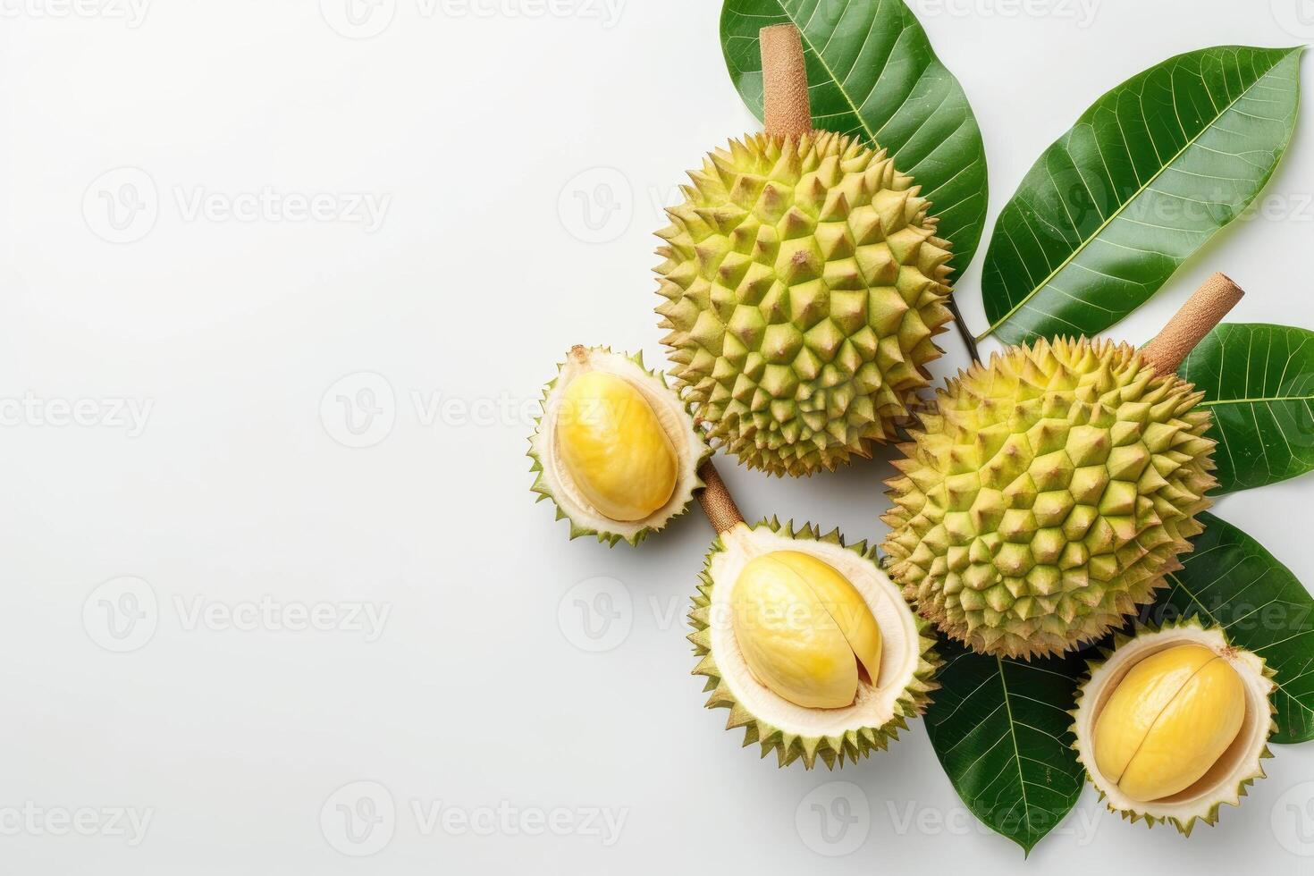 AI generated Fresh Durian Fruit With Leaves Laid Out on a Bright White Background Whole and peeled durian fruits, known for their distinctive smell, are presented with green leaves against a clean photo