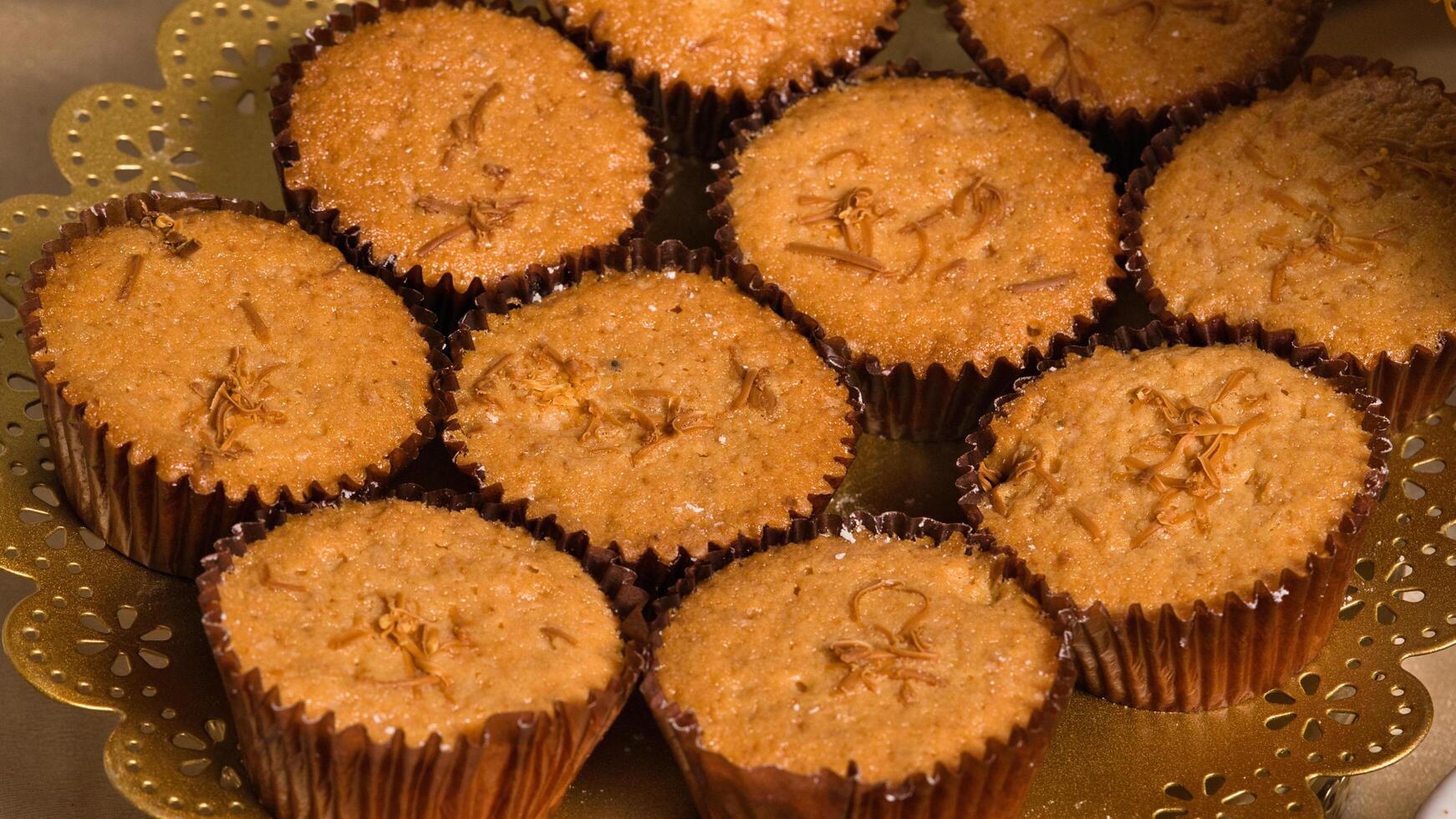 a plate of cupcakes on a table photo