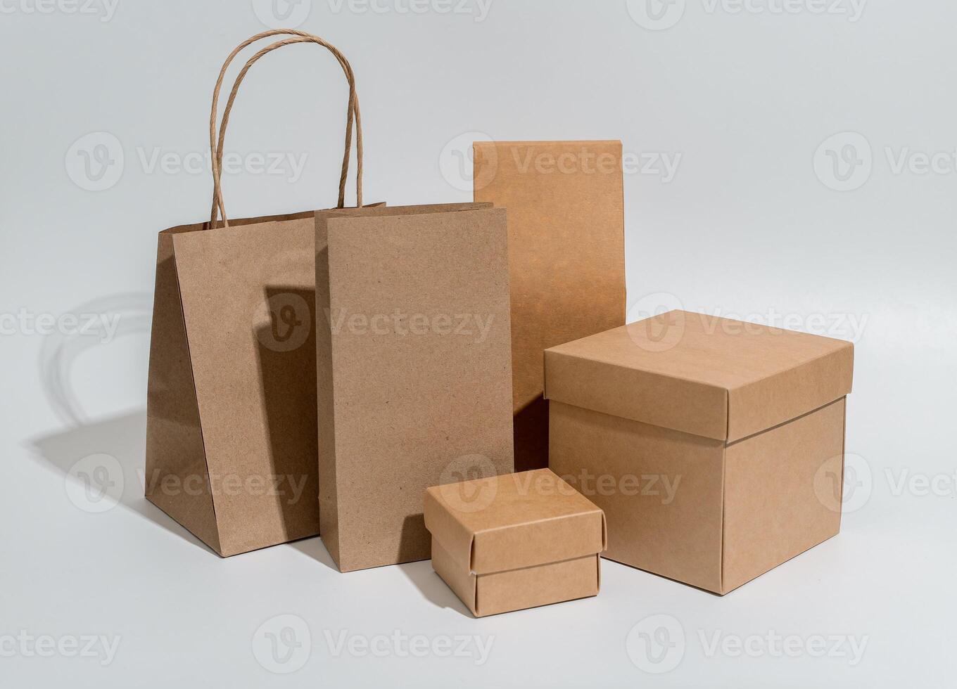 Kraft packages, boxes, bag, brown beige packs for gifts, purchases set photo
