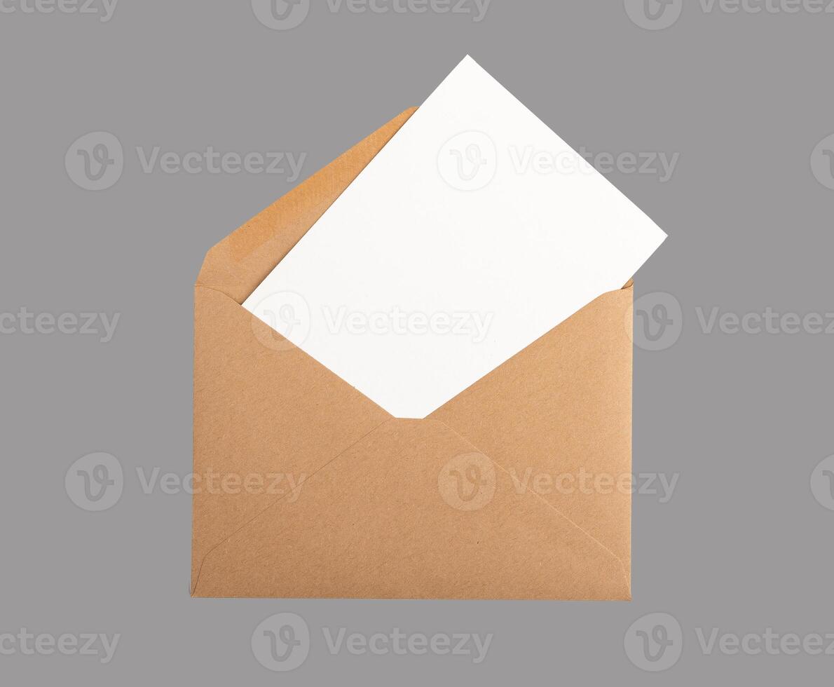 Postcard, card mock up, clean white paper from open kraft envelope isolated on white background photo