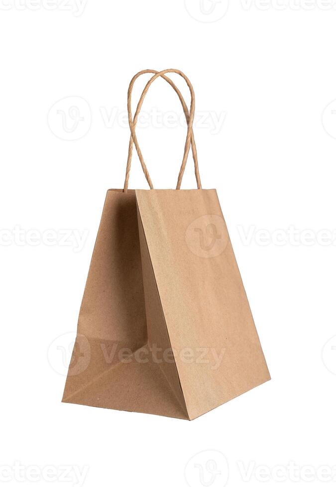 Kraft brown paper bag with handles, isolated on white background photo