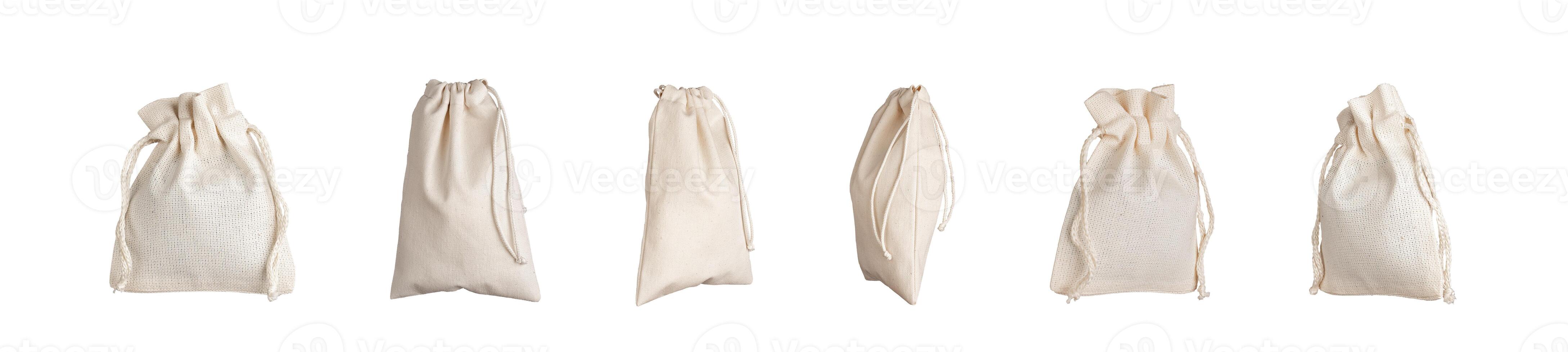 Textile bags with strings set, pack mockup. Natural eco fabric linen sack isolated on white photo